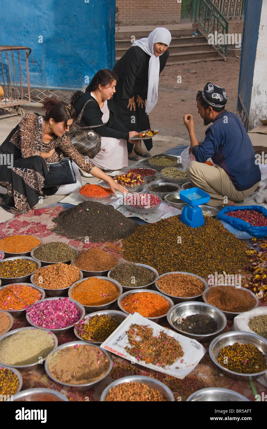 Selling spices at Sunday market, Kashgar, Xinjiang, China Stock Photo