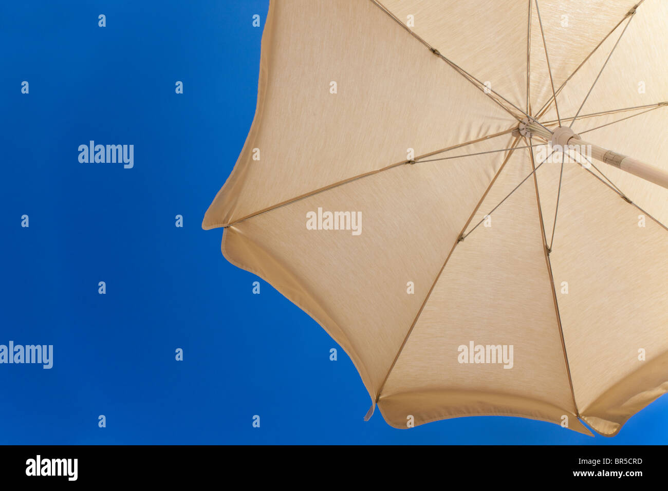 Sun umbrella being used as a sun shade Stock Photo
