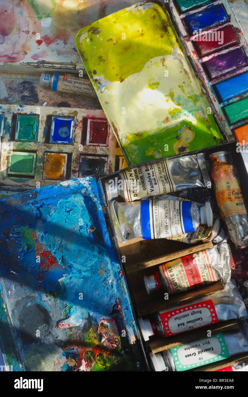 Three overlapping, vintage, antique, used artist's watercolor paint