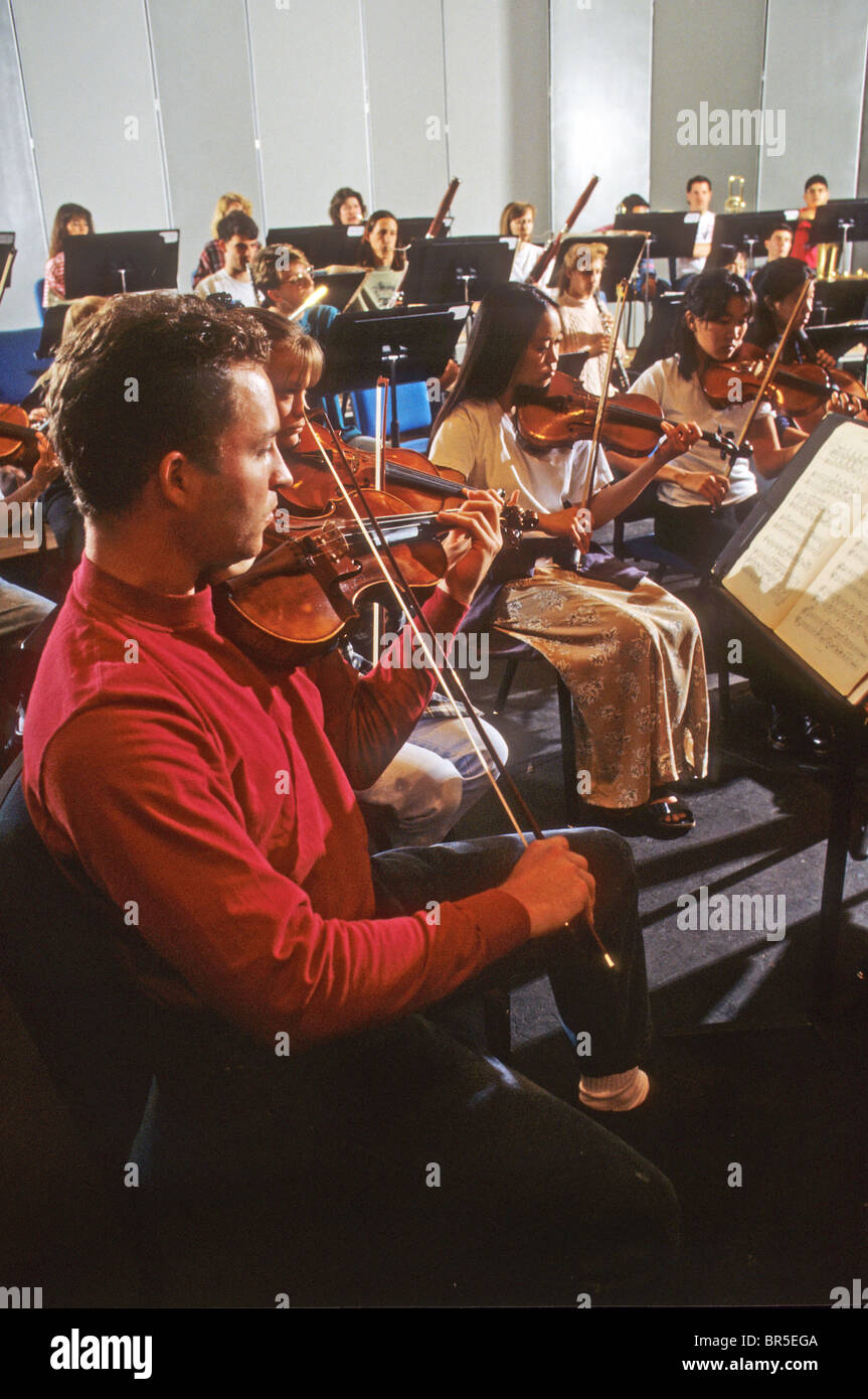 teen orchestra instrument music play woodwind uniform asian