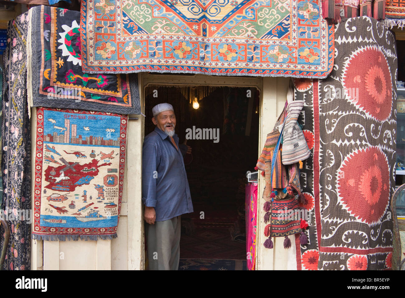 Selling carpets at Sunday Market, Kashgar, Xinjiang, China Stock Photo