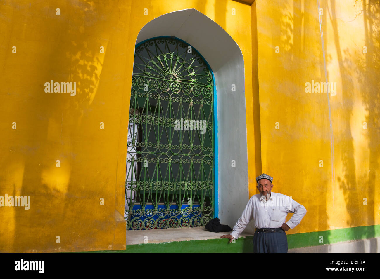 Uighur man inside Id Kah Mosque, Kashgar, Xinjiang, China Stock Photo