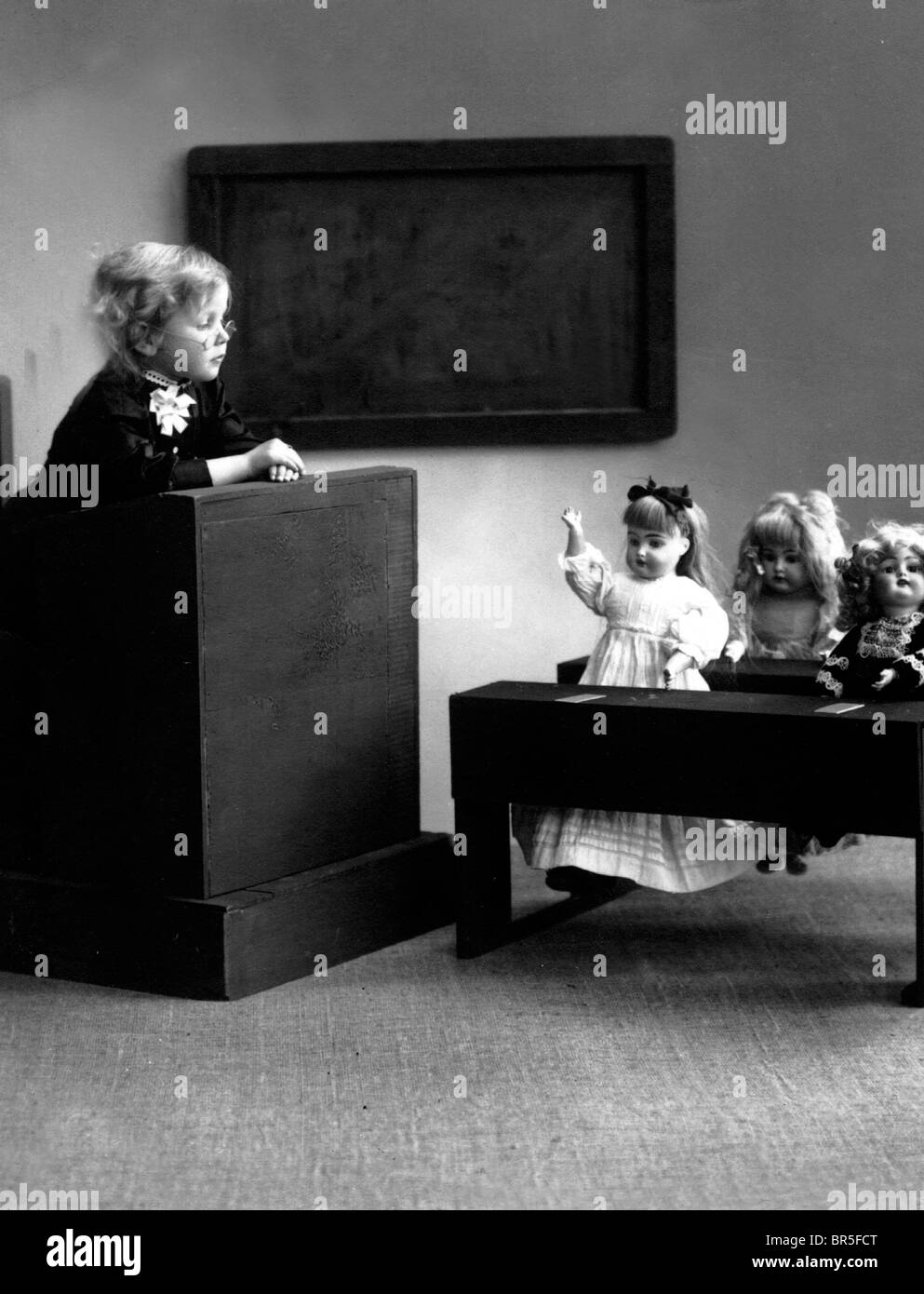 Historic photograph, girl playing school with dolls, around 1930 Stock Photo