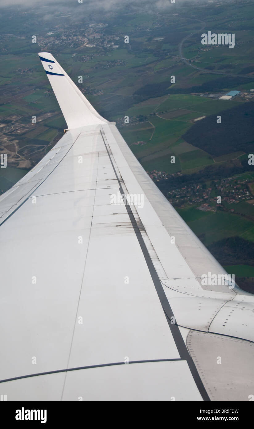 The view through El Al commercial flighty The Israeli flag on the wing tip Stock Photo