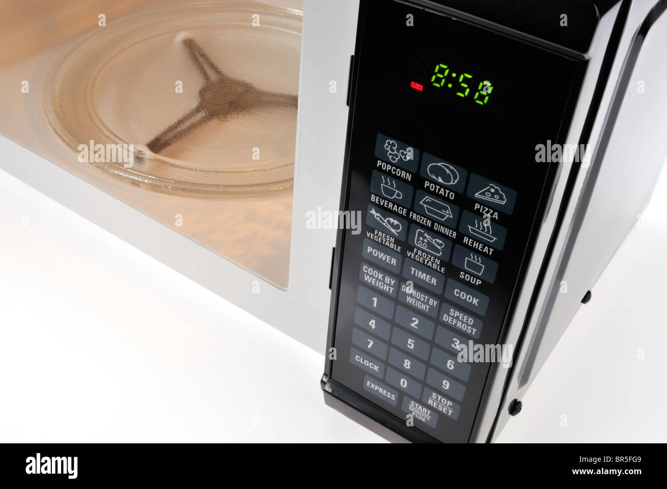 Empty microwave oven with digital clock and touch pad display controls
