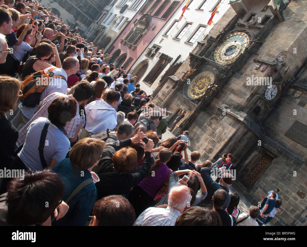 People waiting for the Astronomical Clock to start playing, Prague Stock Photo