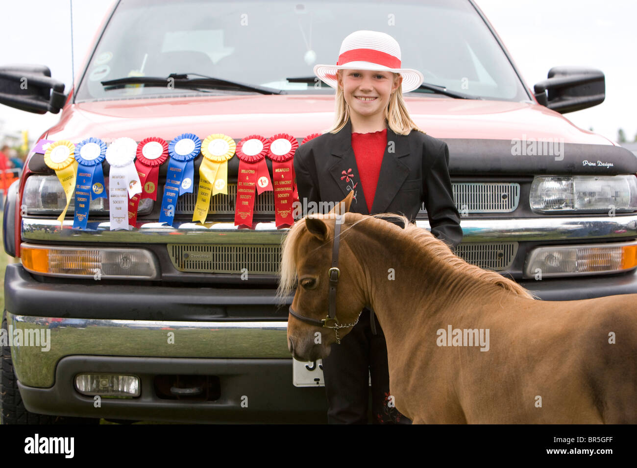 North America Canada Ontario girl with miniature pony and ribbons at agricultural fair Stock Photo
