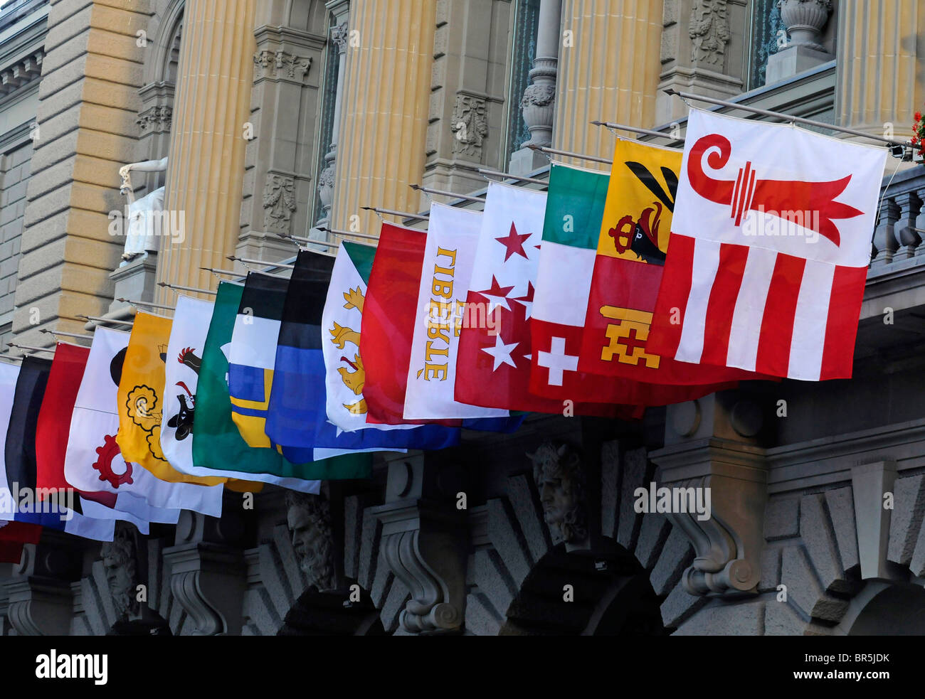 Flags of all the 26 Swiss cantons on display on the Federal Parliament 'Bundeshaus' in Bern, Switzerland. Stock Photo