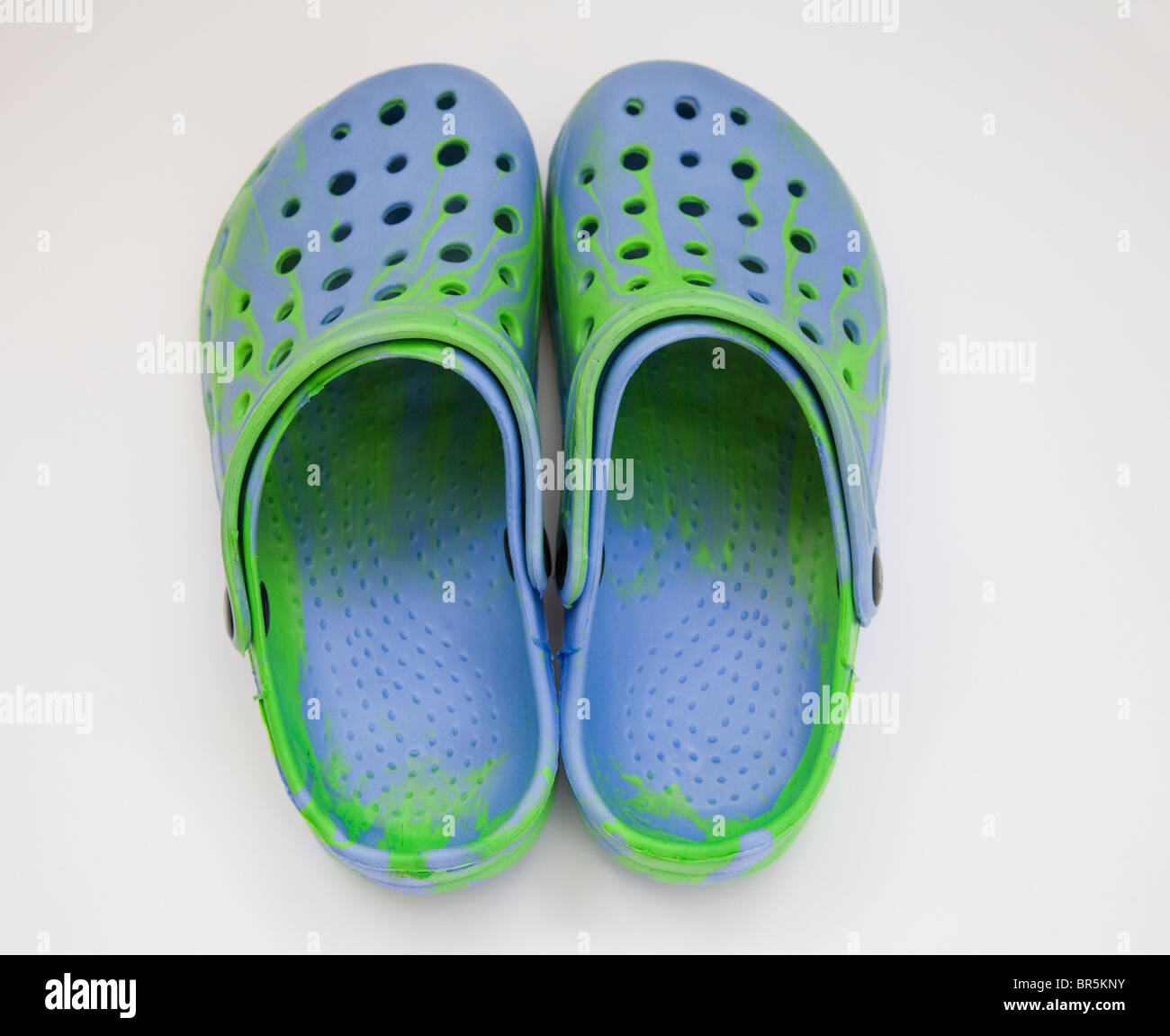 Close up pair of blue and green Croc style leisure shoes made in China  Stock Photo - Alamy