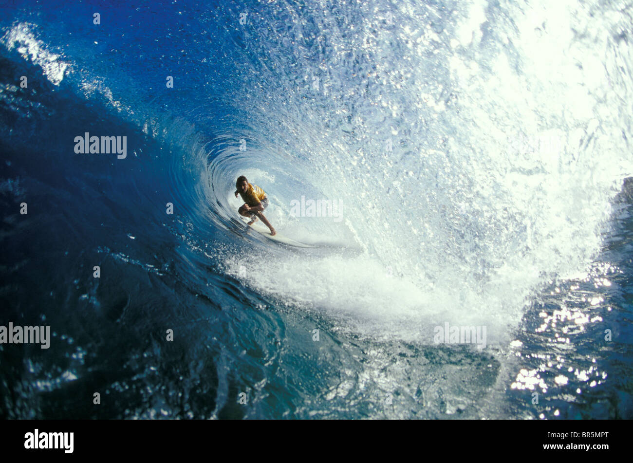 Surfer deep in the tube at Off The Wall on Oahu's north shore. Stock Photo