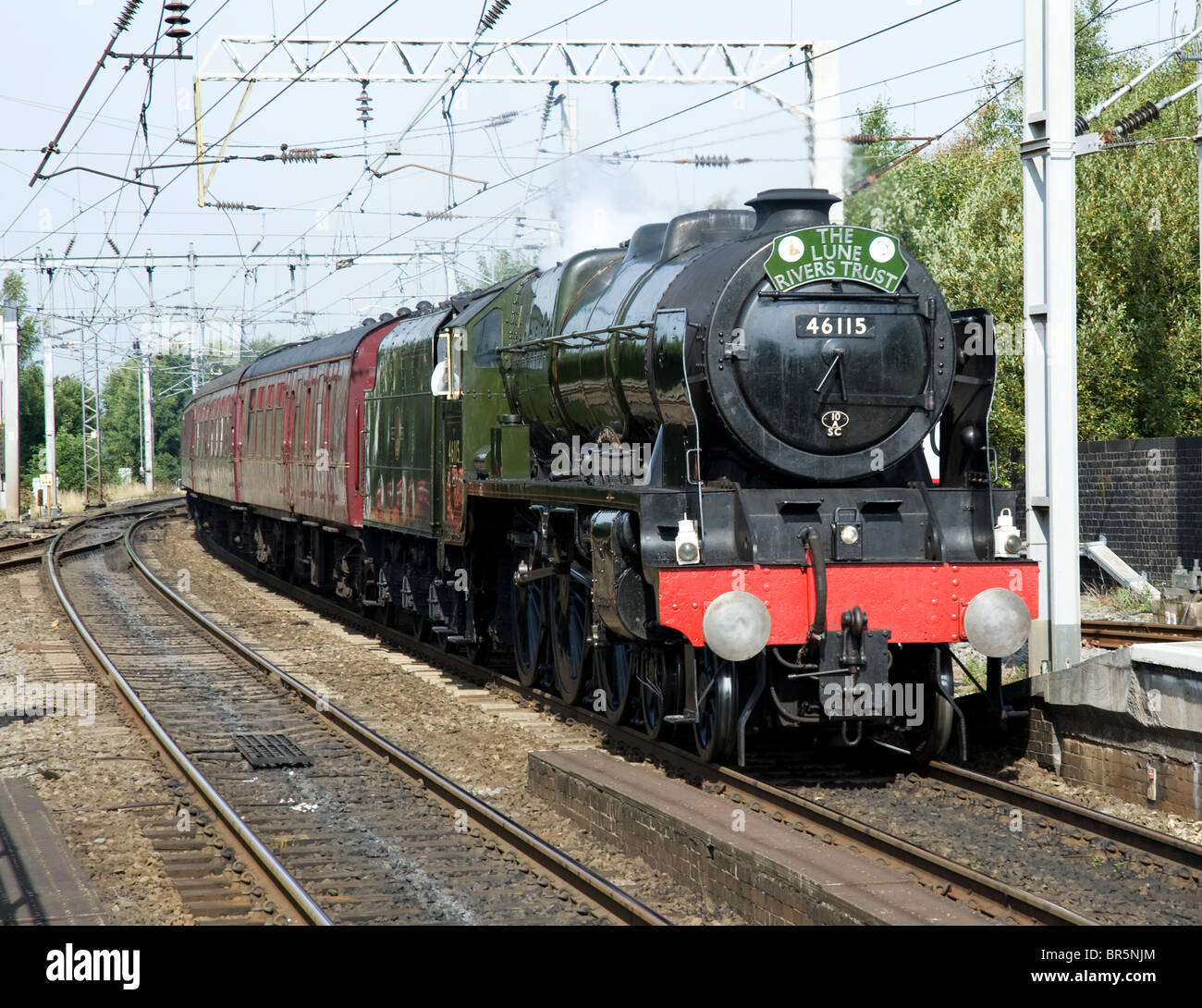 The 'Rebuilt Royal Scot' class locomotive, 'Scots Guardsman' hauling a steam special between Carnforth and Lancaster to Chester. Stock Photo