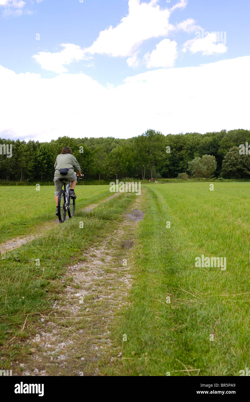 Woman cycling in the Nature Stock Photo
