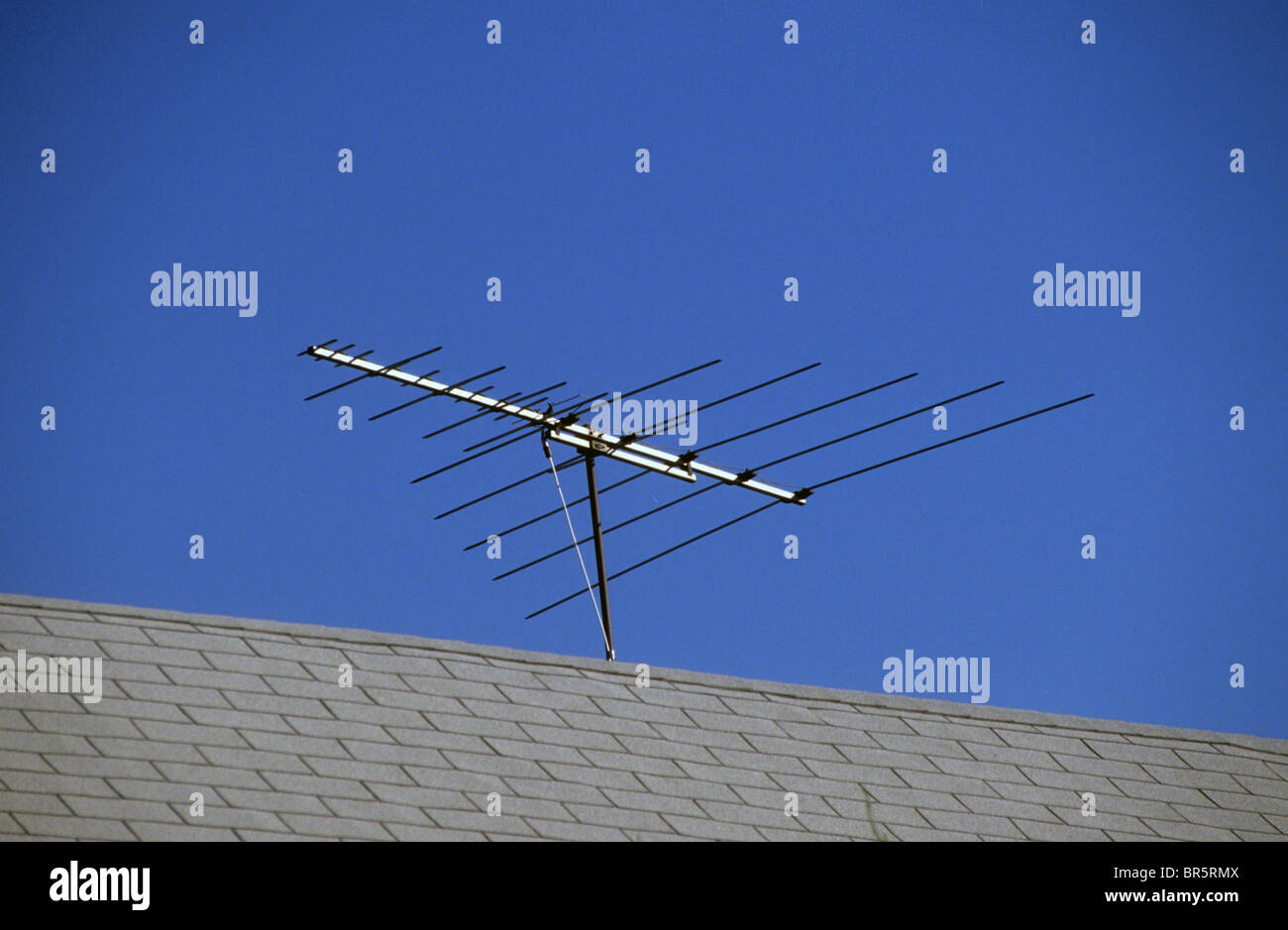 TV television antenna receive signal roof top mount mast bar UHF VHF signal  strength direction aim point direct Stock Photo - Alamy