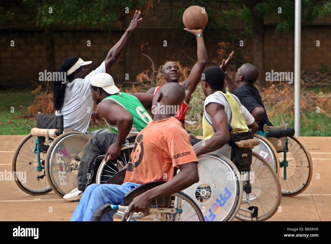 Competition is fierce during the wheelchair basketball training session in Burkina Faso. Stock Photo
