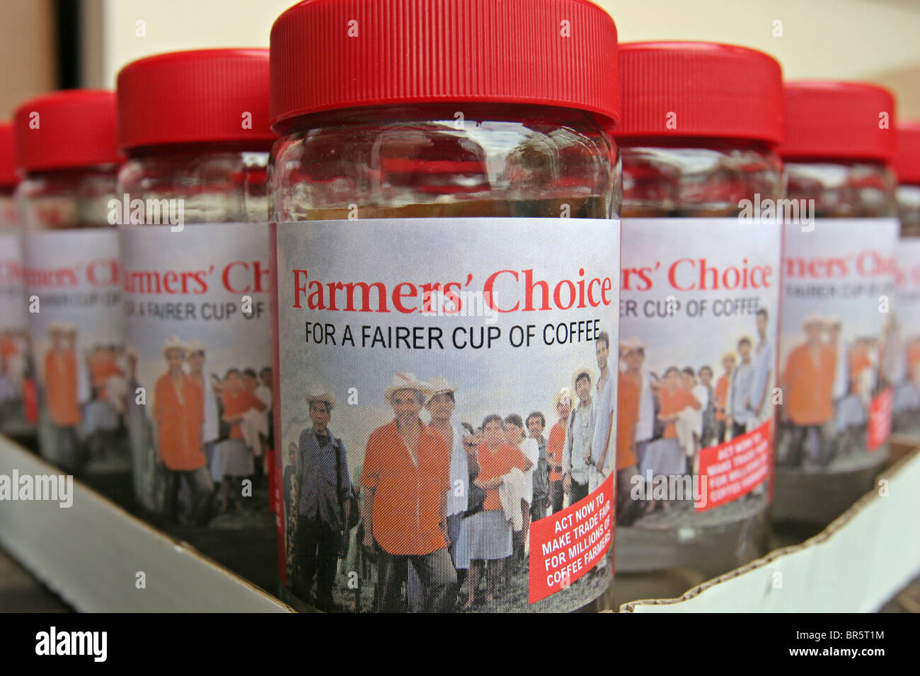 An Oxfam campaign for fair trade coffee production with mock coffee jars called Farmers choice. Stock Photo