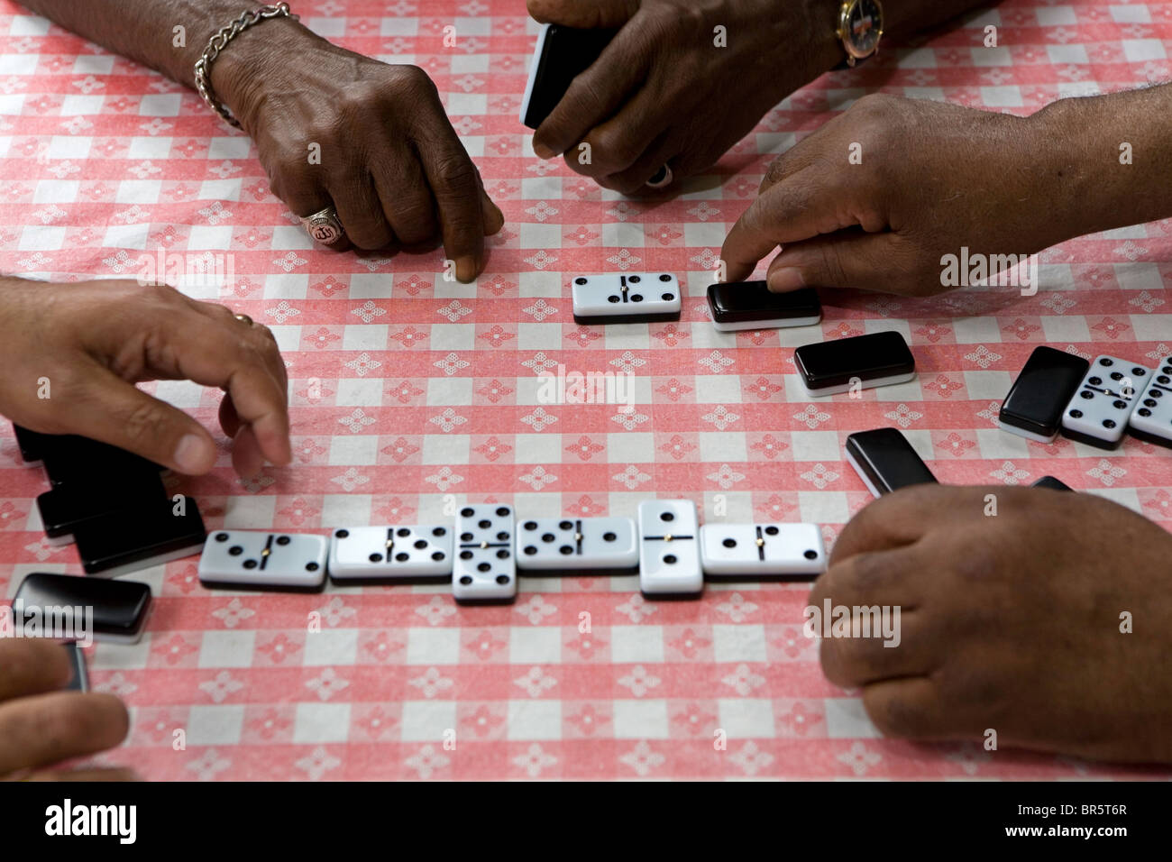 Playing dominos at a Caribbean pensioners club in North London. Stock Photo