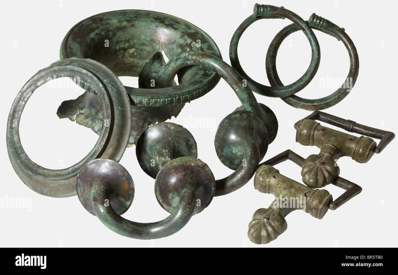 Four fragments of a hydria, one pair of handles and two armlets, Macedonian, 5th century B.C. Bronze casting, hammered and with low-temperature working, some parts with beautiful decorations. Light green and dark green patina. Orifice of the hydria 15.5 cm in diameter. Provenance: Collection Dr. H., Rhineland, 1960s. historic, historical, 20th century, ancient world, ancient world, ancient times, object, objects, stills, clipping, cut out, cut-out, cut-outs, jewellery, jewelry, Stock Photo