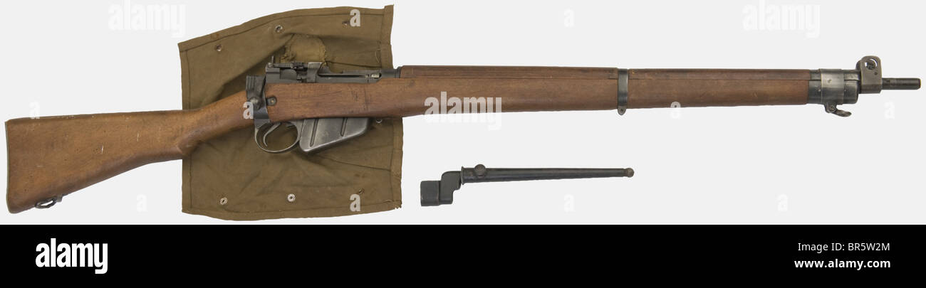 An English Lee-Enfield rifle MK I, number 4, calibre 303 British, number 19713, made in 1943. Original bluing (50%), aluminium buttplate, no sling, with a cloth dust cover. The stock a bit worn, with its spike bayonet and scabbard. historic, historical, 1930s, 20th century, gun, guns, firearm, fire arm, firearms, fire arms, weapons, arms, weapon, arm, fighting device, object, objects, stills, clipping, clippings, cut out, cut-out, cut-outs, military, militaria, piece of equipment, Stock Photo