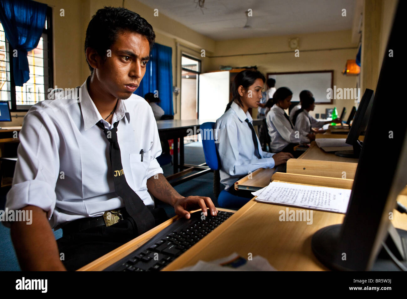 Boy during an IT class is taking place at the Jyoti Vocational Training and Rehabilitation Centre in Nepal. Stock Photo