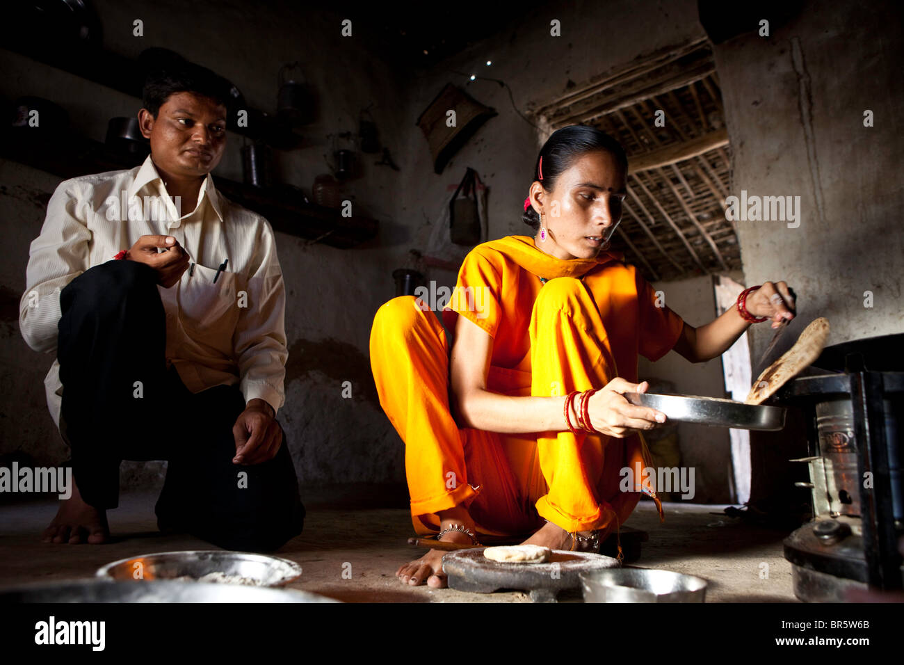 16-year-old Hansa who is deaf and blind, learning to cook. Deepak is trained by Sense International in Ahmadabad, India. Stock Photo