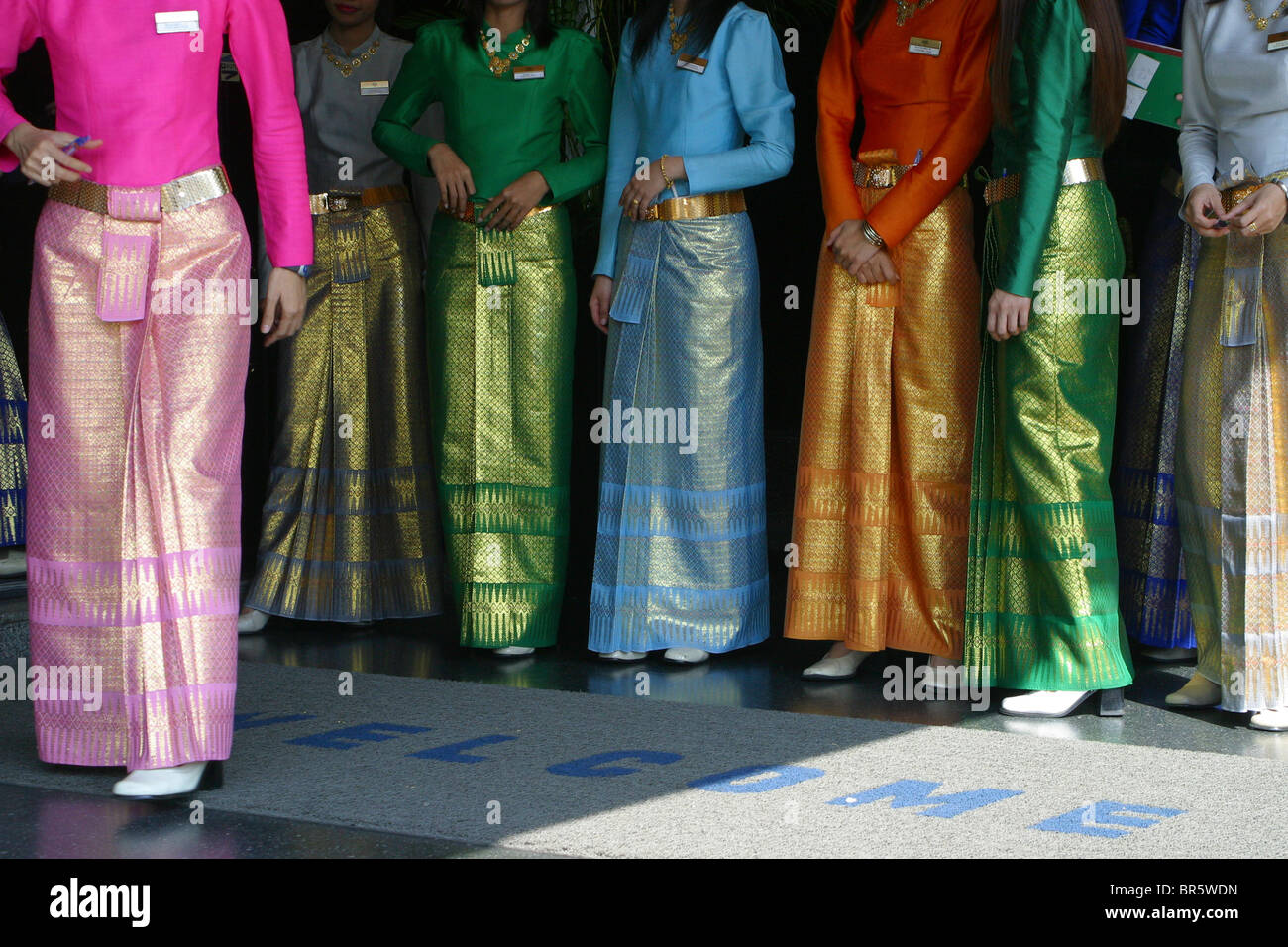 A group of welcoming ladies wearing sarongs at a Gold and Gem factory outlet in Bangkok, Thailand. Stock Photo
