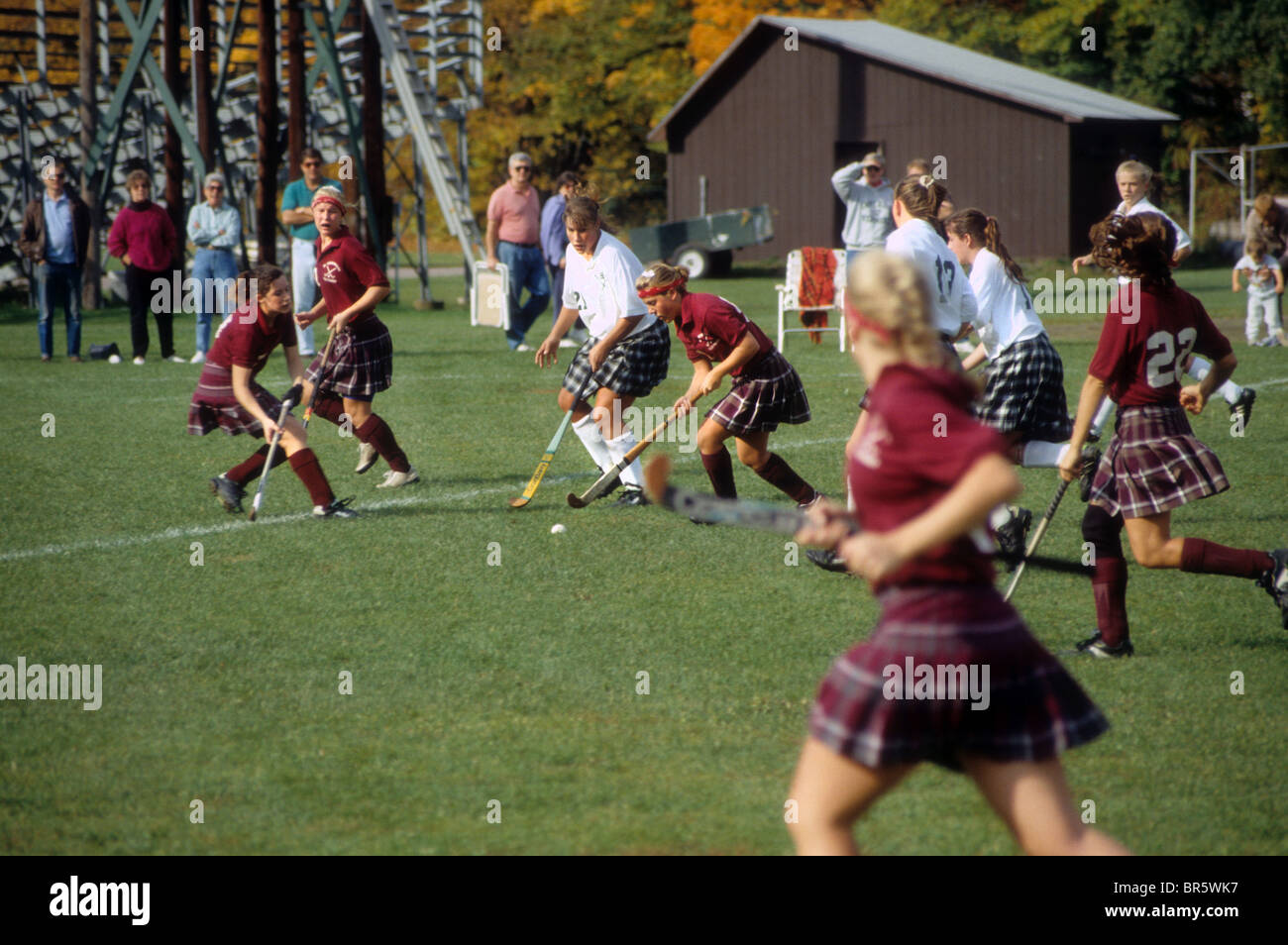 Girls field hockey grass field stick ball New England USA Stock Photo