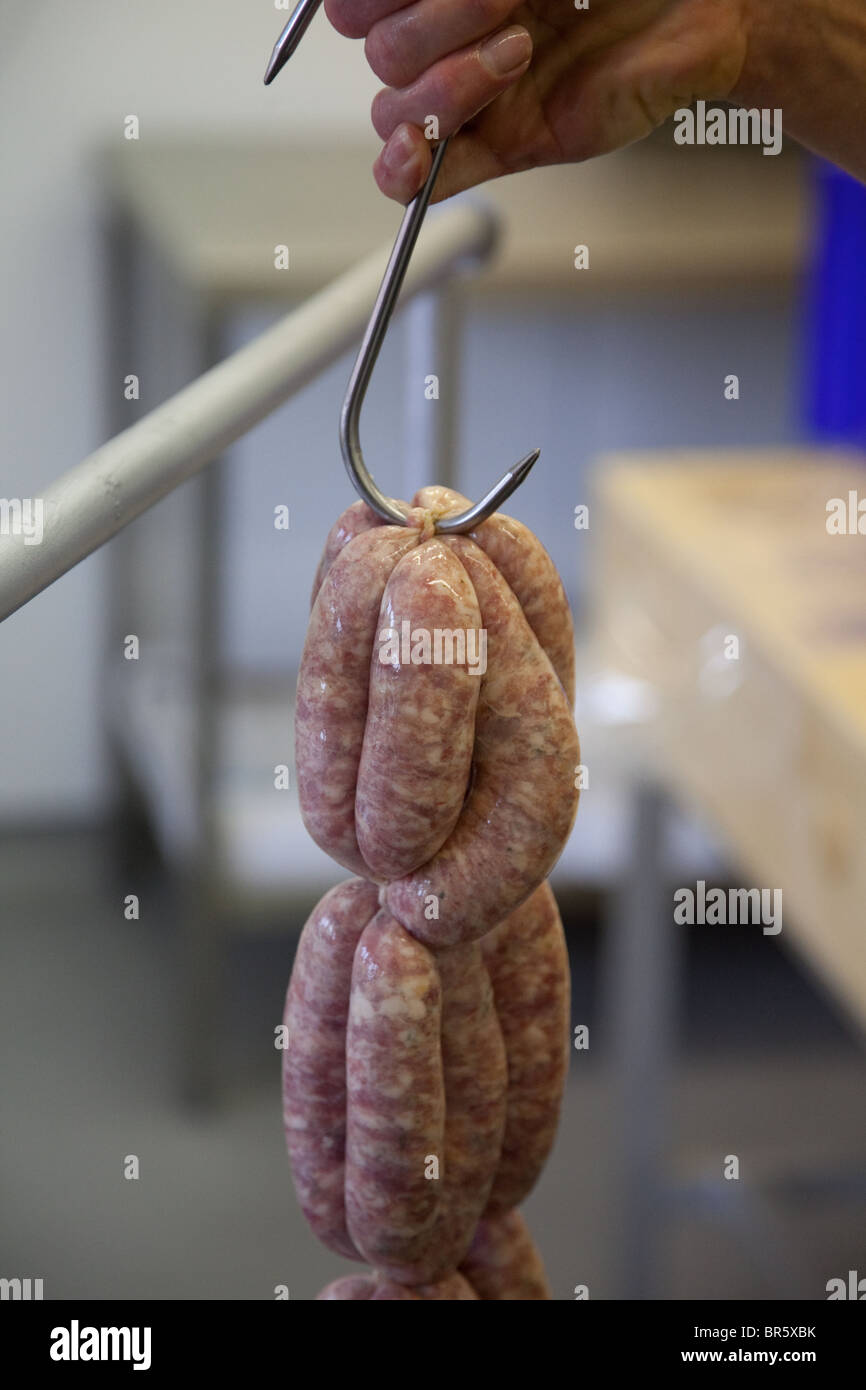 Pork sausages being made by hand Stock Photo Alamy