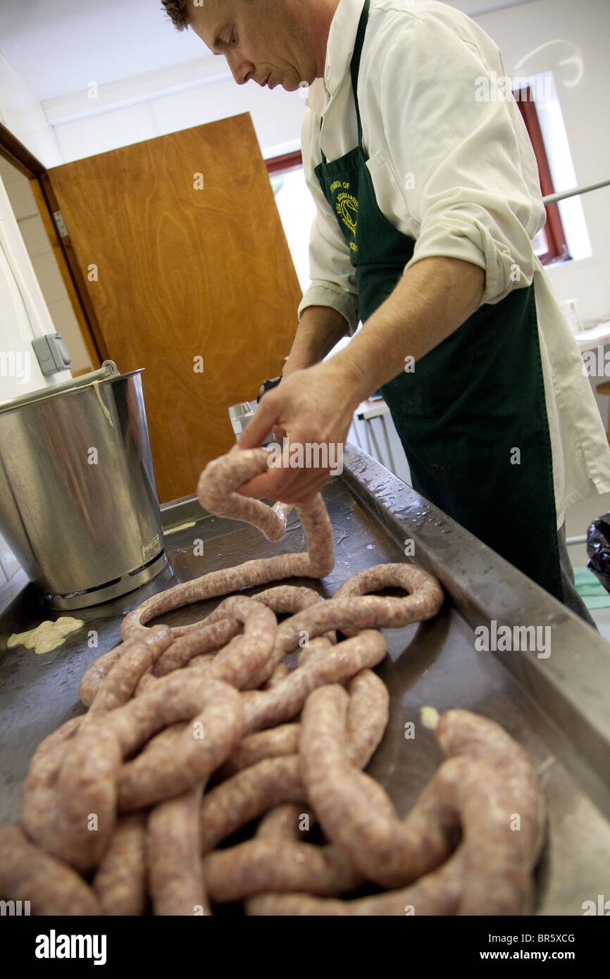 Pork sausages being made by hand Stock Photo Alamy