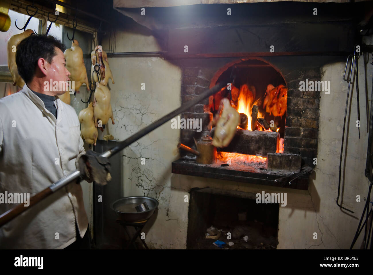 Roasting duck in the oven, Beijing, China Stock Photo