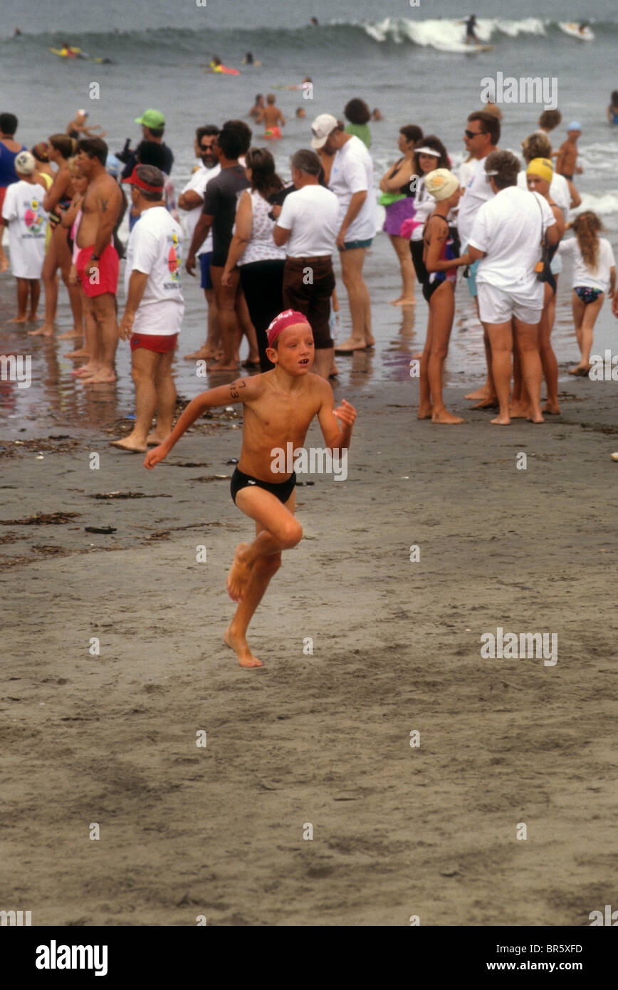 beach run race swim biathlon boy speedo sand ocean sea Stock Photo - Alamy