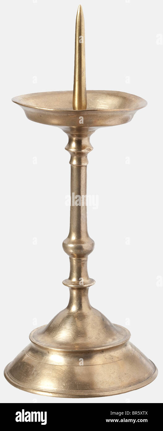 A pair of candle holders, Nuremberg, circa 1600 Brass holders cast in one piece with bellshaped