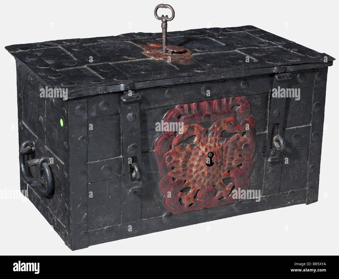 A German war chest, circa 1750 Rectangular strongbox with iron strap fittings. Hinged lid with seven latches, a keyhole with hammered escutcheon in colour and movable keyhole cover. Large lock cover plate on the inside with a coloured depiction of a decorative basket with flowers and fruits. Bogus lock on the front side, the richly hammered and openwork decorative escutcheon in the shape of a double-headed eagle. Two replacement hasps, a movable carrying handle on either side. Original colour version. Dimensions 77 x 43 x 44.5 cm. historic, historical, 18th cen, Stock Photo