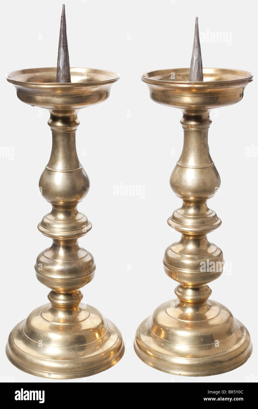 A pair of large German pricket candlesticks, circa 1600 Brass