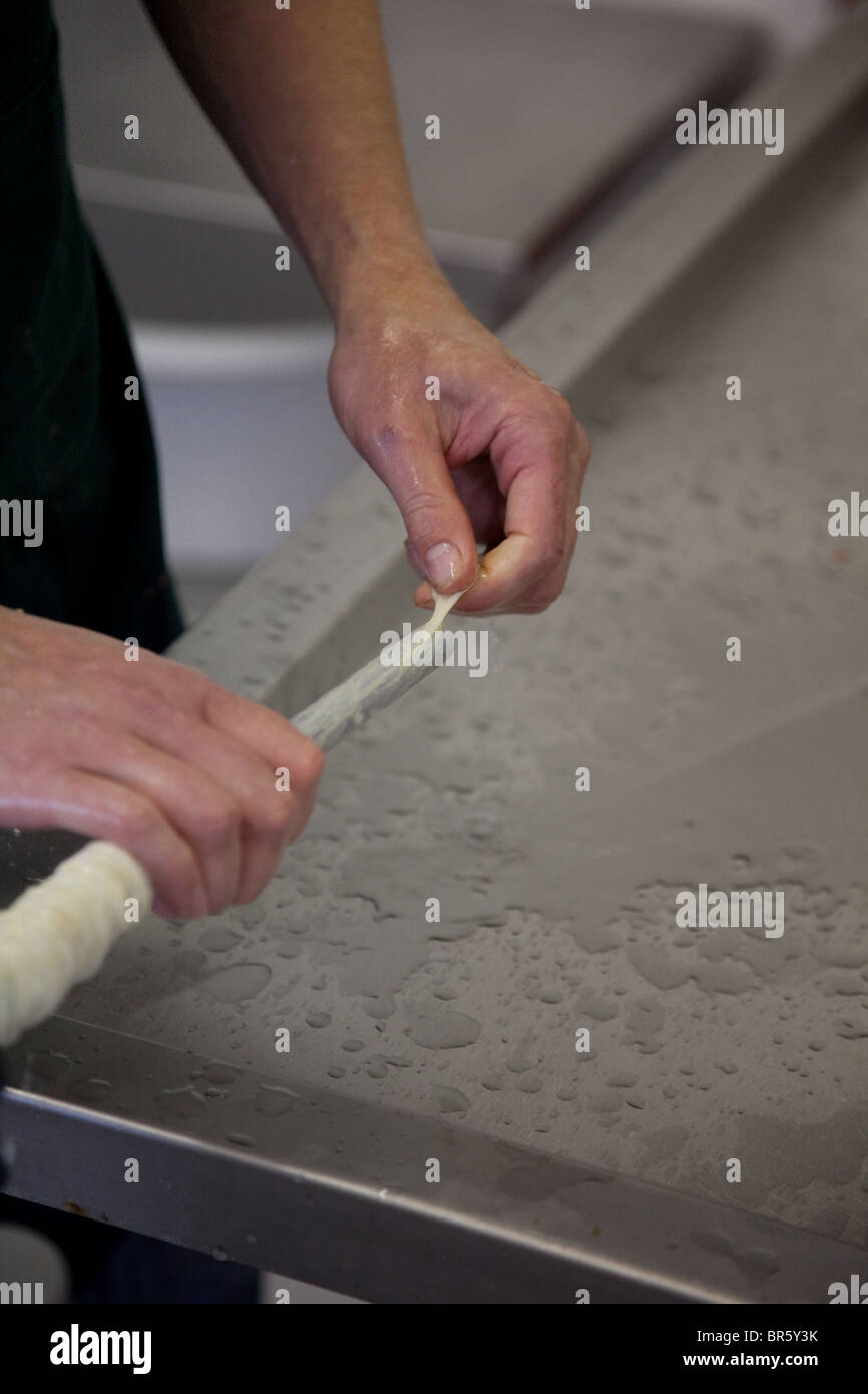 Pork sausages being made by hand Stock Photo Alamy