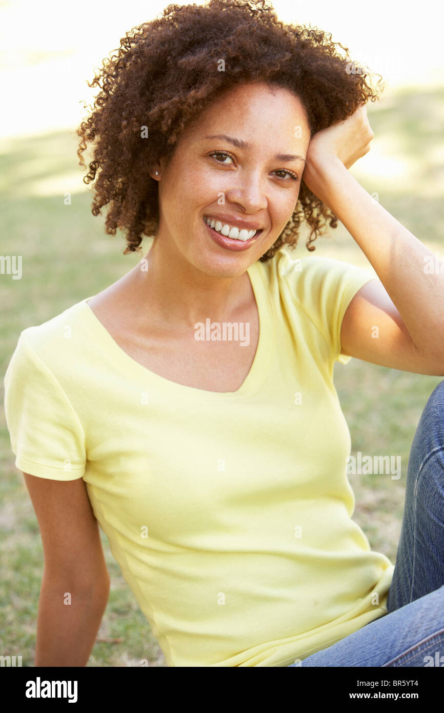 Portrait Of Young Woman In Park Stock Photo - Alamy