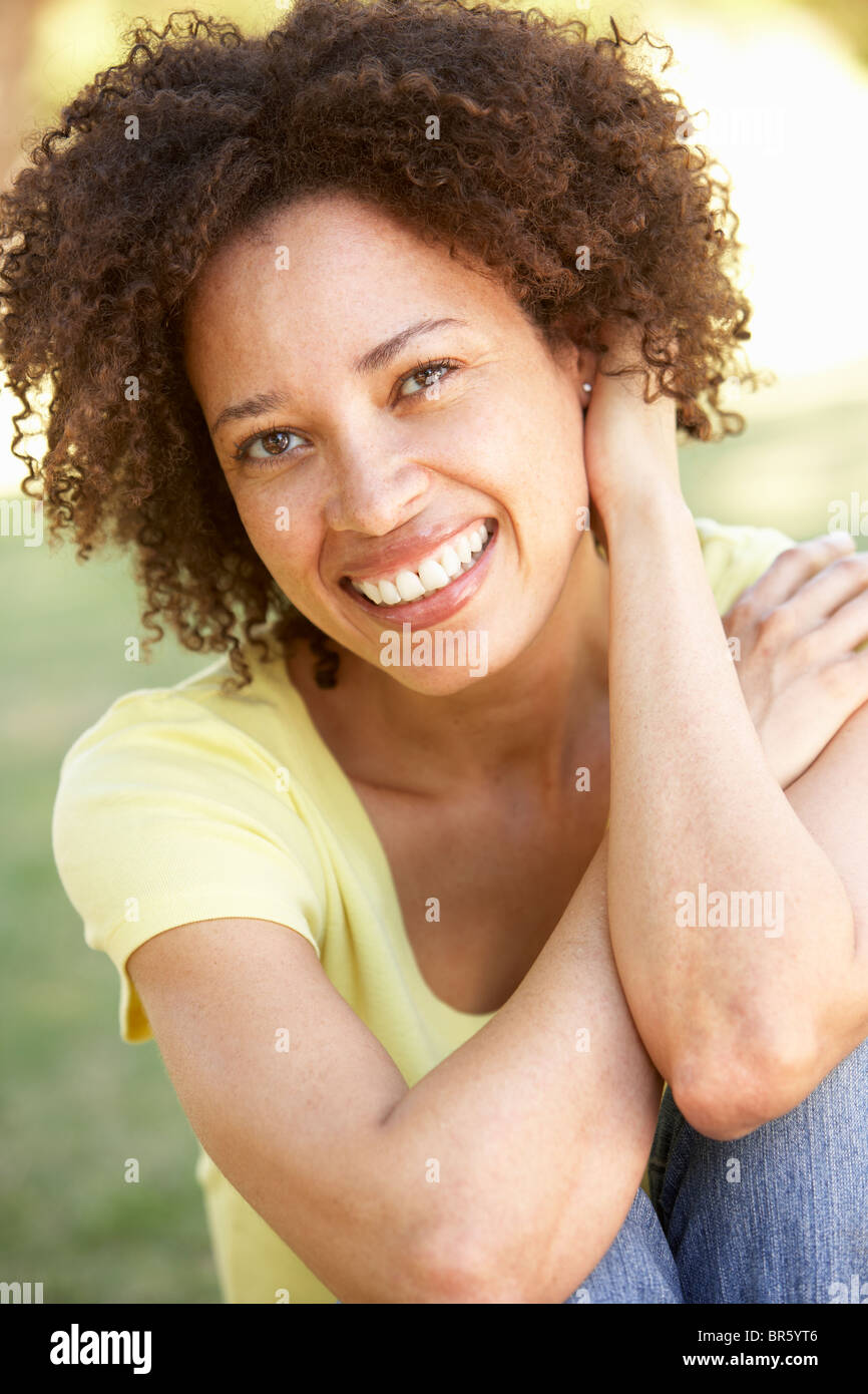 Portrait Of Young Woman In Park Stock Photo
