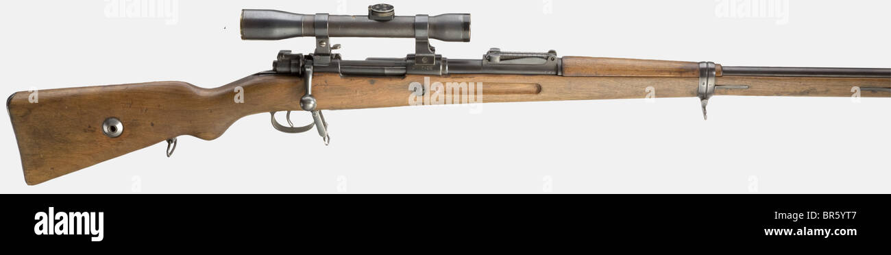 A scope rifle 98 with Gérard scope, Reichswehr, 8 x 57 cal., no. 4136a. No matching numbers as most usual with Reichswehr rifles. Bright bore. Curved bolt-handle. Tangent sight scaled 1 - 20. Manufacturer's name on receiver head hidden by mount. Reichswehr acceptance mark. Old, hardly noticeable refinish. Walnut stock with cleaning rod. Muzzle cap. On linear frog mount for aiming over open sight, with unusual, unknown pedestal on receiver head for double recess of front base, a matt finished scope 'Dr. Walter Gérard / Charlottenburg / M 4 x' with unit mark '15., Stock Photo