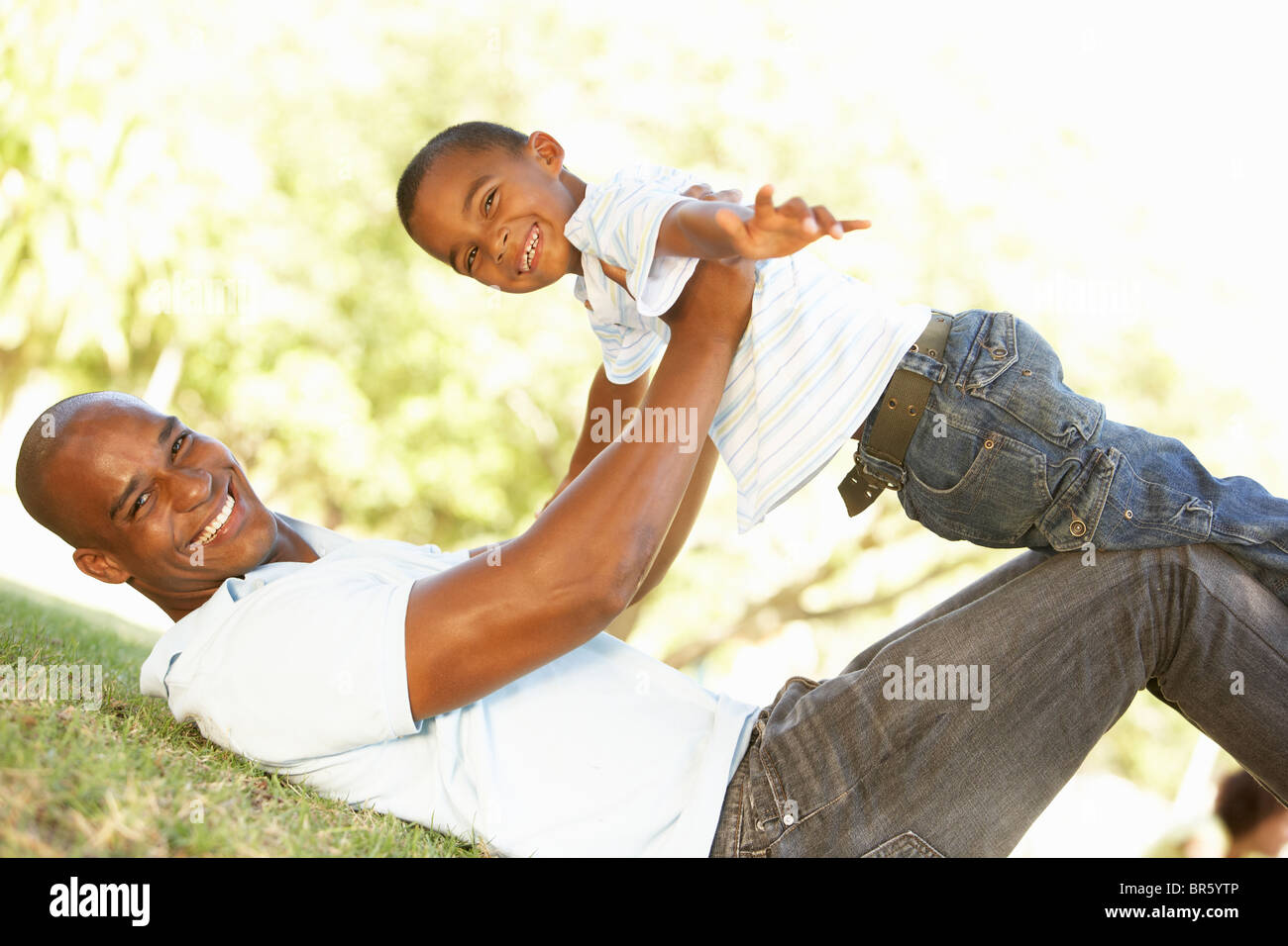 Portrait of Happy Father and Son In Park Stock Photo - Alamy