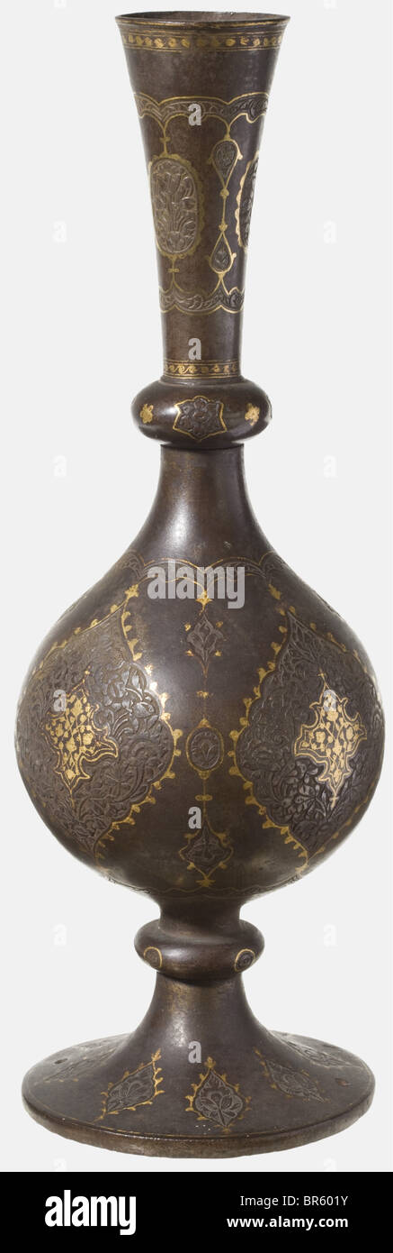 A gold-inlaid Persian vase, 19th century Composed of three pieces of hammered iron, cut with floral decoration and gold-inlaid cartouches. The foot with two small drill holes. Can easily be improved by cleaning. Height 33.8 cm. historic, historical, 19th century, Persian Empire, object, objects, stills, clipping, clippings, cut out, cut-out, cut-outs, fine arts, art, artful, Stock Photo