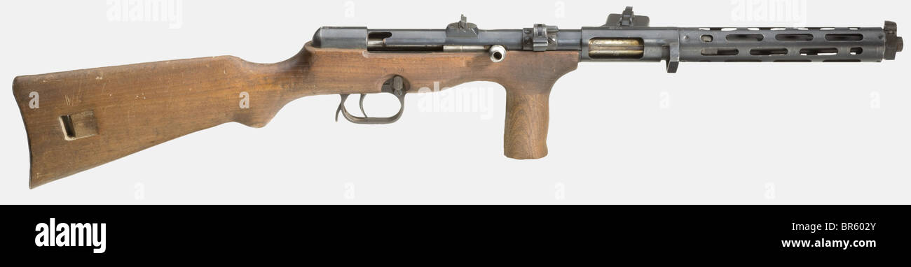 An original submachine gun ERMA 'EMP', St. Etienne (DEKO/wall hanger), cal. 9 mm Parabellum, no. 17928. Matching numbers. Proof mark: eagle/'N'. On the receiver marked 'E M P / 17928'. Fixed one-flap sight. Selector single-/continuous fire. Safety on barrel housing. Original, complete finish minimally spotted. Walnut stock with pistol grip. Without magazine. Very good condition. Rare. This French wall hanger modification may only be sold for export (BKA exemption available). historic, historical, 20th century, ordnance weapon, service weapon, weapons, arms, wea, Stock Photo