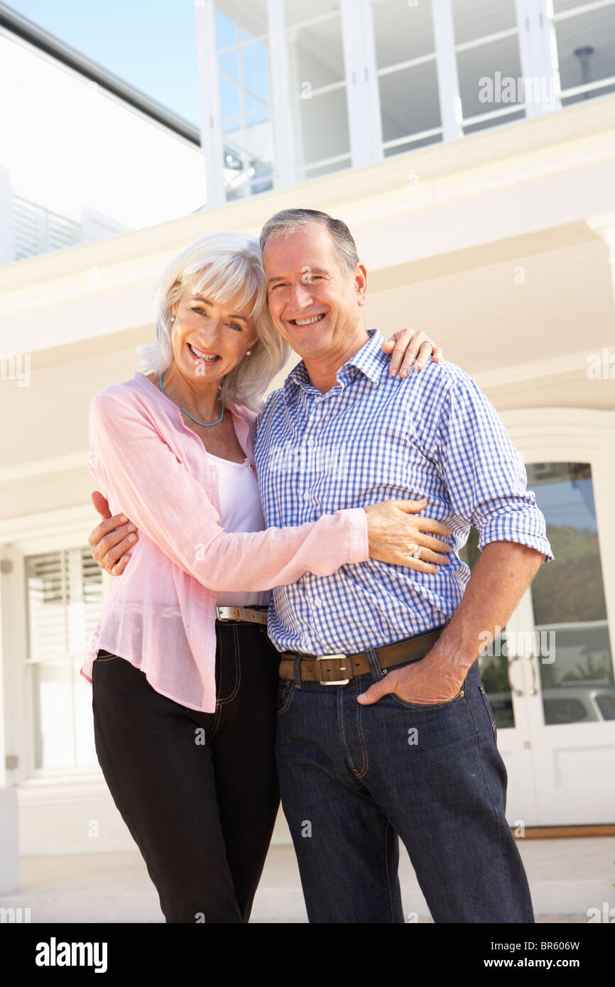 Senior Couple Standing Outside Dream Home Stock Photo - Alamy