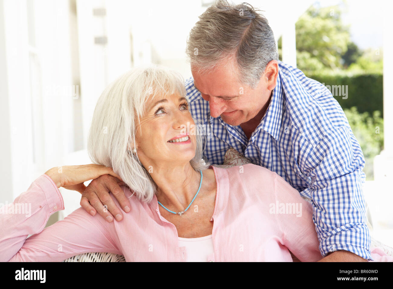 Portrait Of Senior Couple Relaxing Together On Sofa Stock Photo - Alamy