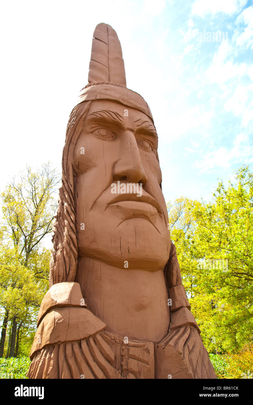 'Crooked Feather', a carved cypress log copy by Thomas King in Ocean Springs, Mississippi, USA Stock Photo