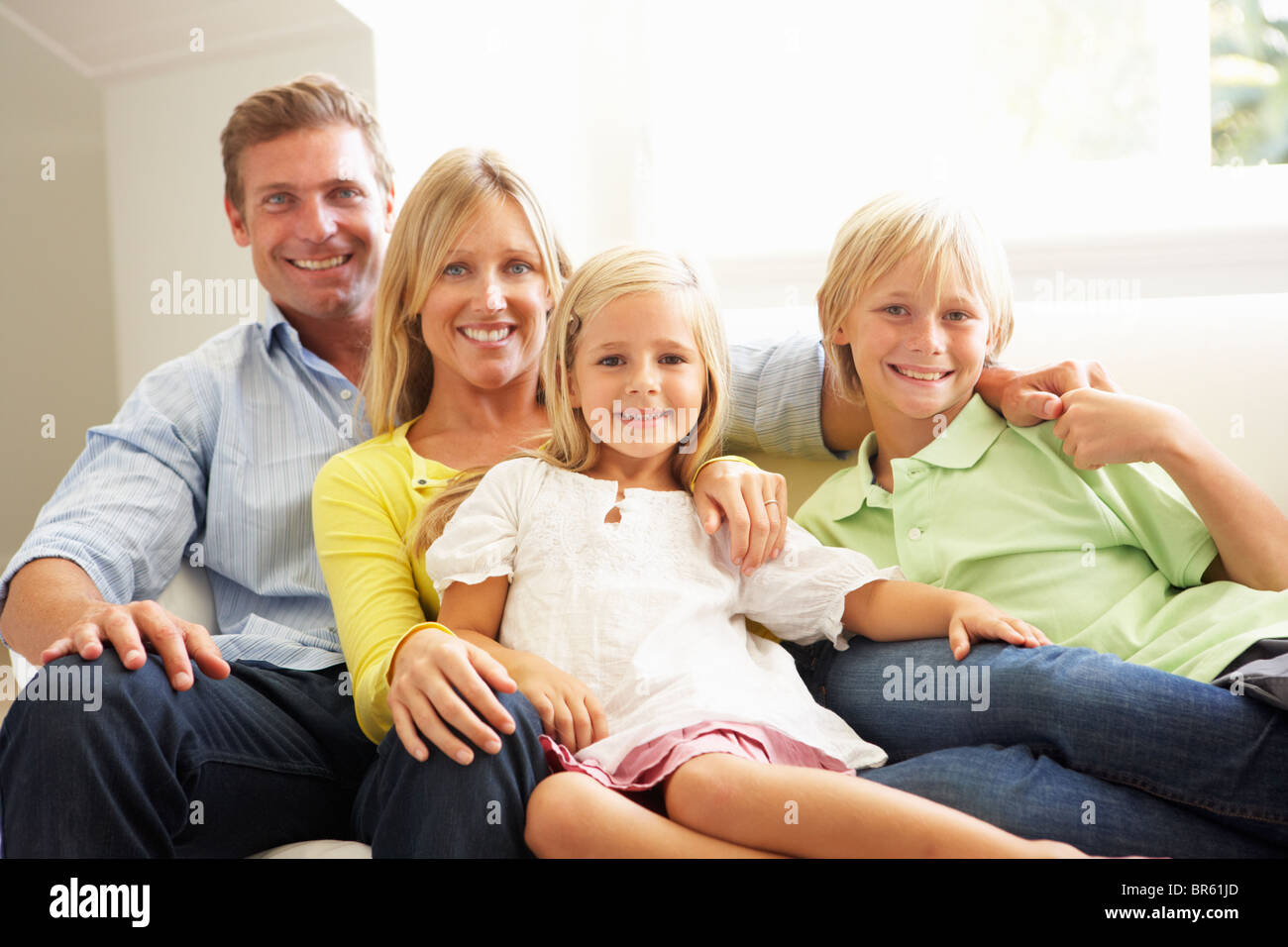Happy family four young hi-res stock photography and images - Alamy