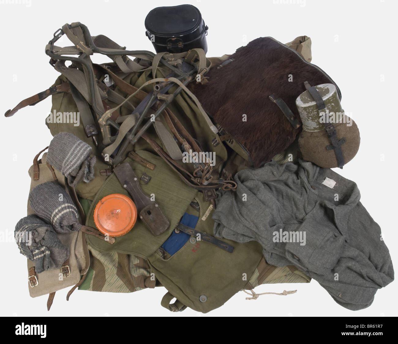 A group of Wehrmacht equipment, including a Tornister haversack with hooks,  two clothing bags of green cloth, a canteen with cup, a breadbag with  carrying strap, tan canvas gaiters, black leather Y-straps (