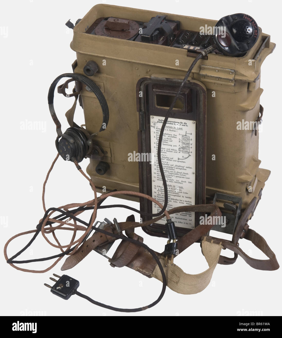 A Wehrmacht portable transmitter/receiver radio, type Feldfu.B1, complete  with accessories (adjustment belt, headphones and microphone, the aerial is  missing), both lids still present, dated 1941, tan painted at 98 %.  historic, historical,