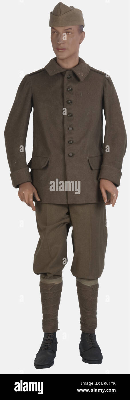 A 1940 French soldier, on mannequin, including a 'mustard' sidecap of prewar manufacture, a M38 tunic with pockets and its crescent buttons, a pair of 'Golf' type trousers of khaki wool, khaki puttees and French M17 ankle boots of leather. historic, historical, people, 1930s, 20th century, uniform, uniforms, piece of clothing, clothes, outfit, outfits, object, objects, stills, clipping, clippings, cut out, cut-out, cut-outs, man, men, male, Stock Photo