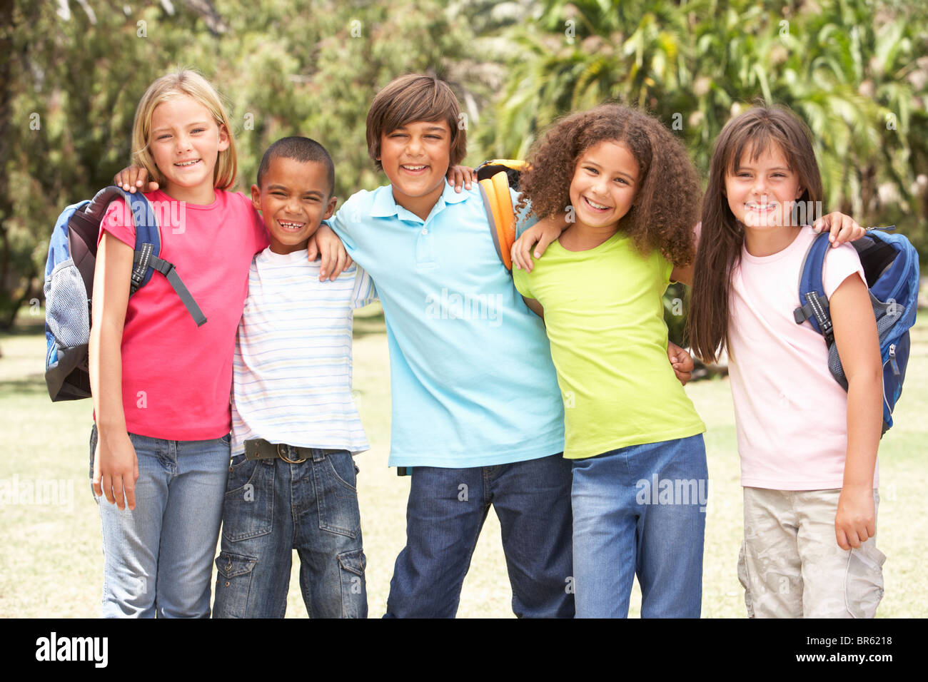 Group Of Schoolchildren Standing In Park Stock Photo - Alamy