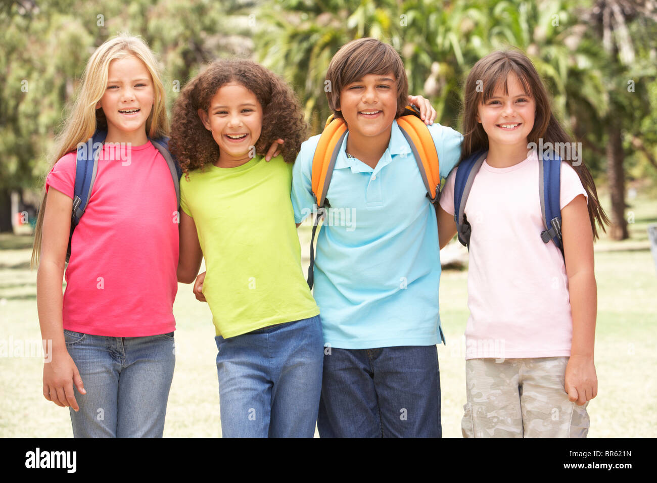 Group Of Schoolchildren Standing In Park Stock Photo - Alamy