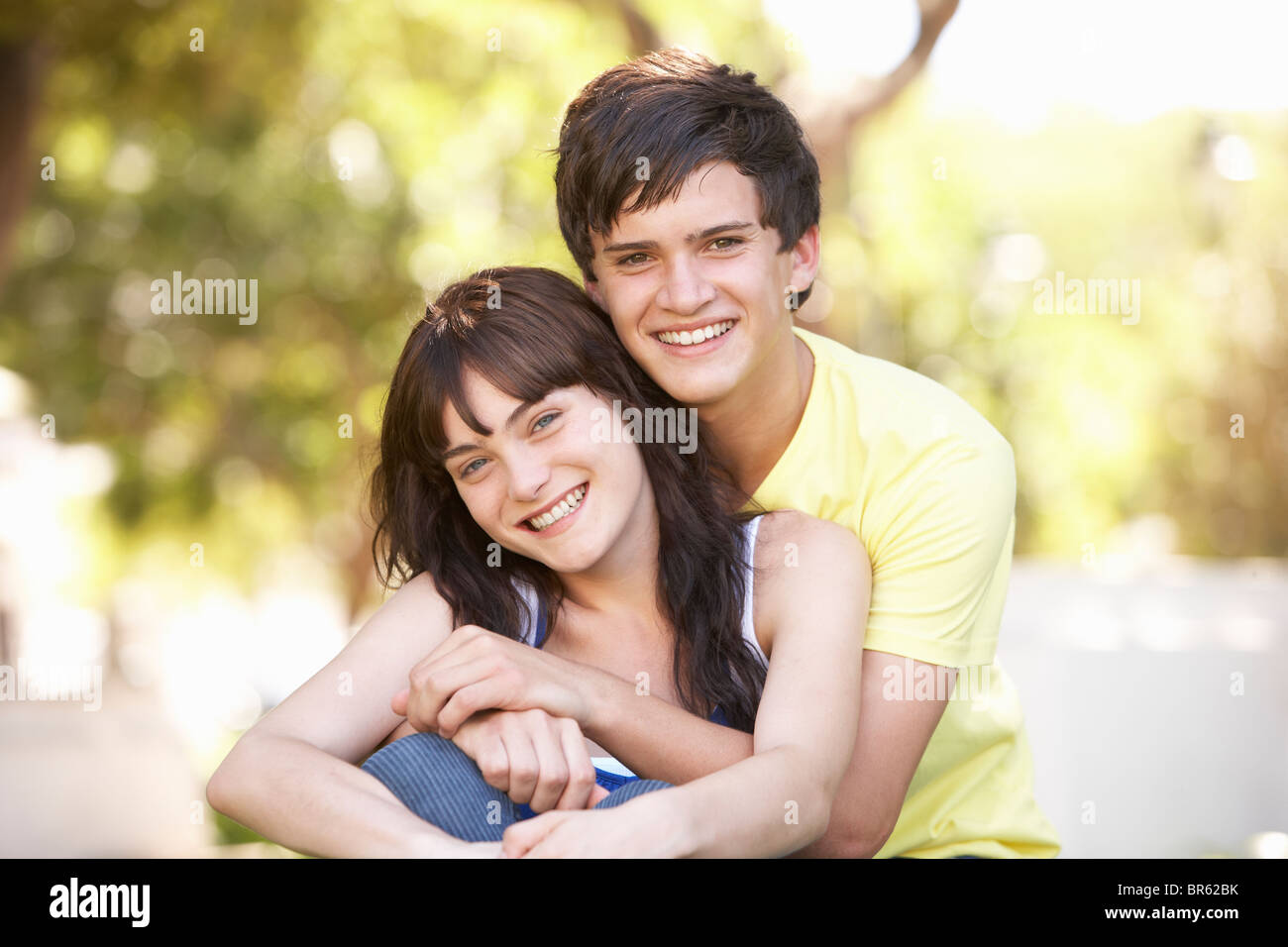 Teenage couple in love cuddling hi-res stock photography and images - Alamy